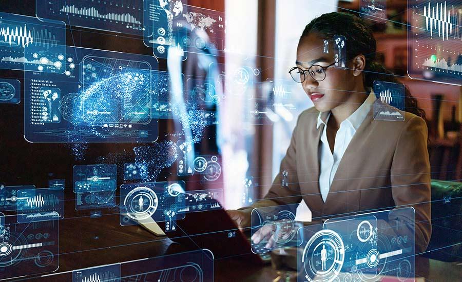 An image depicting a woman working on a computer