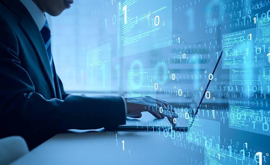 An image depicting a person working on a laptop